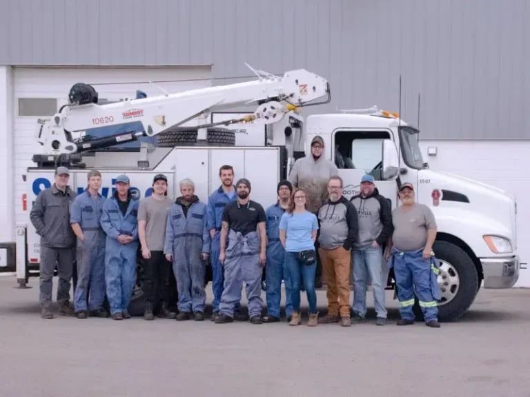 The Foothills crew in front of a service truck