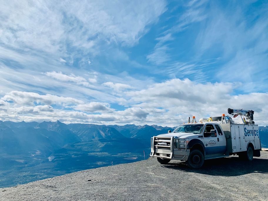 Foothills service truck on a bank above the valley in Sparwood